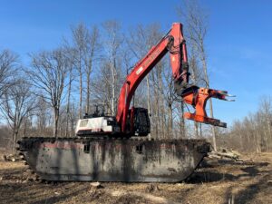 LRI self-performs tree and shrub removal utilizing the LB350X excavator equipped with a ‘Woodcracker’ attachment. The woodcracker works like a feller-buncher and provides a safe and effective means to cut and control trees of various sizes.